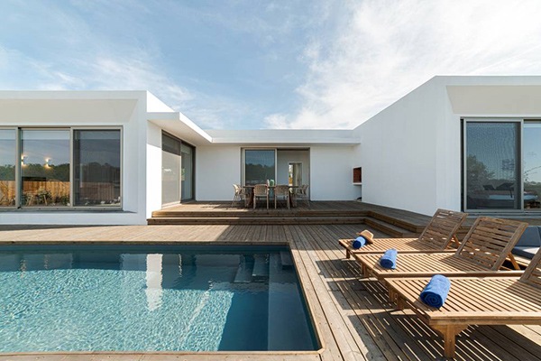 Maison en U : plans d’un habitat original et confortable